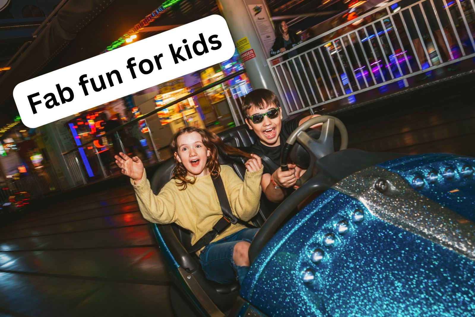 Two children having fun in a dodgem